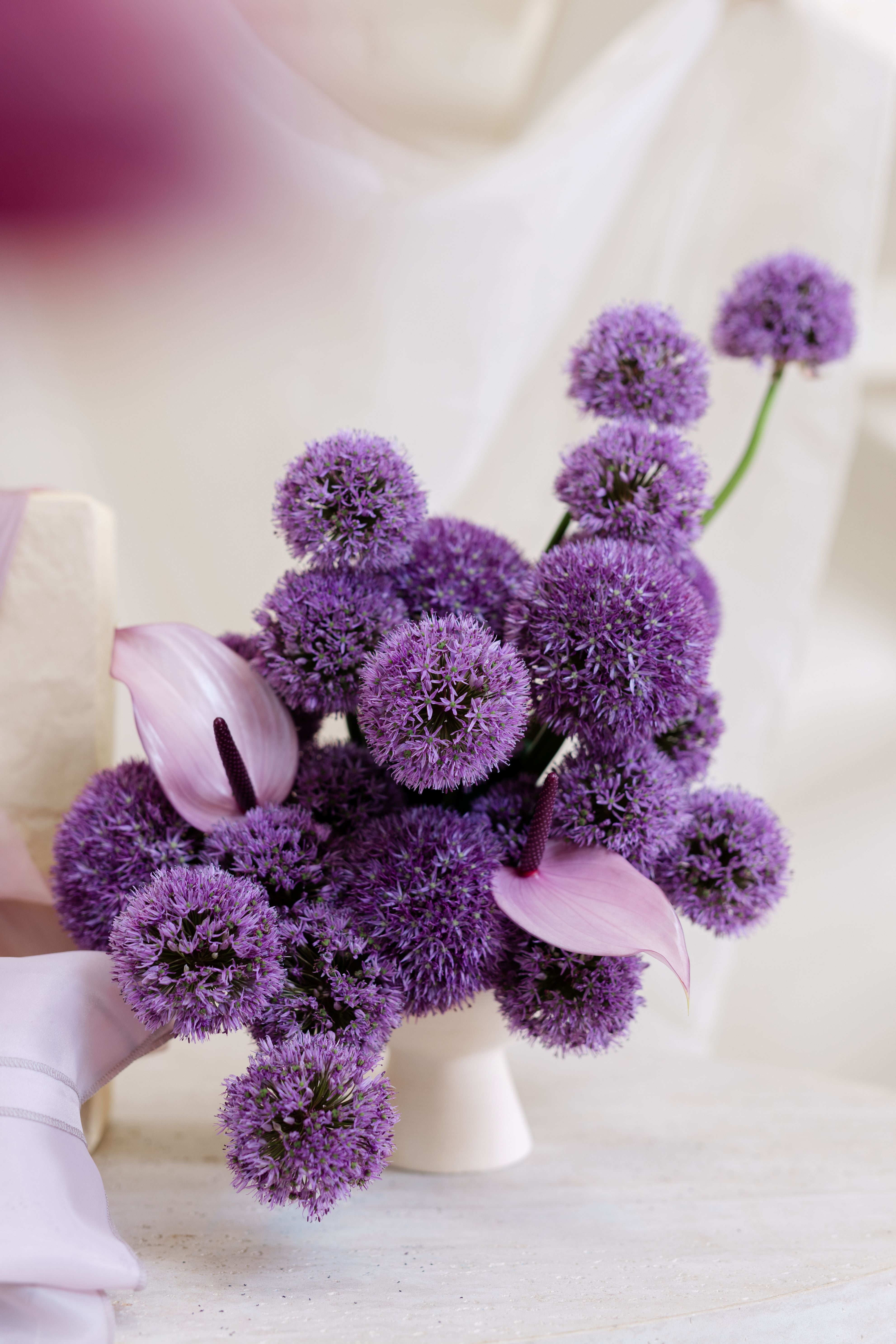 Gifting with Purple Floral Arrangement in a Vase 1