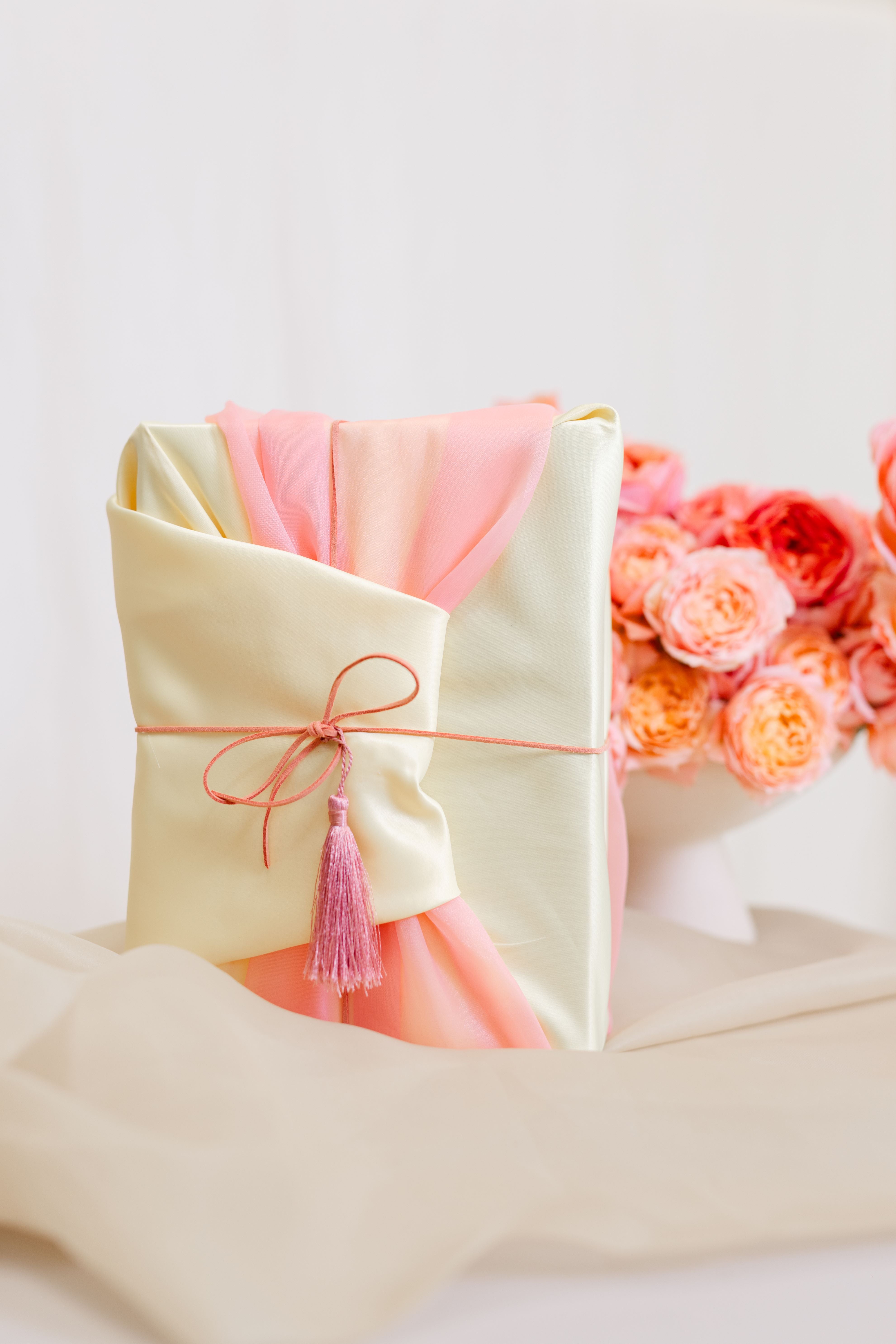 Gifting with Orange Floral Arrangement in a Vase
