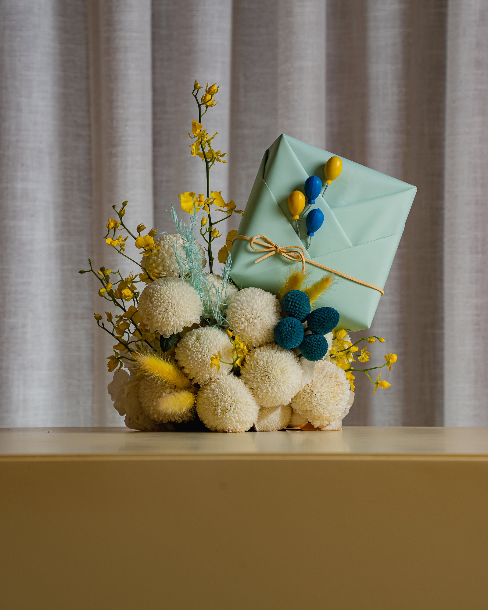 Sunny Yellow and Sky Blue Flower Arrangement