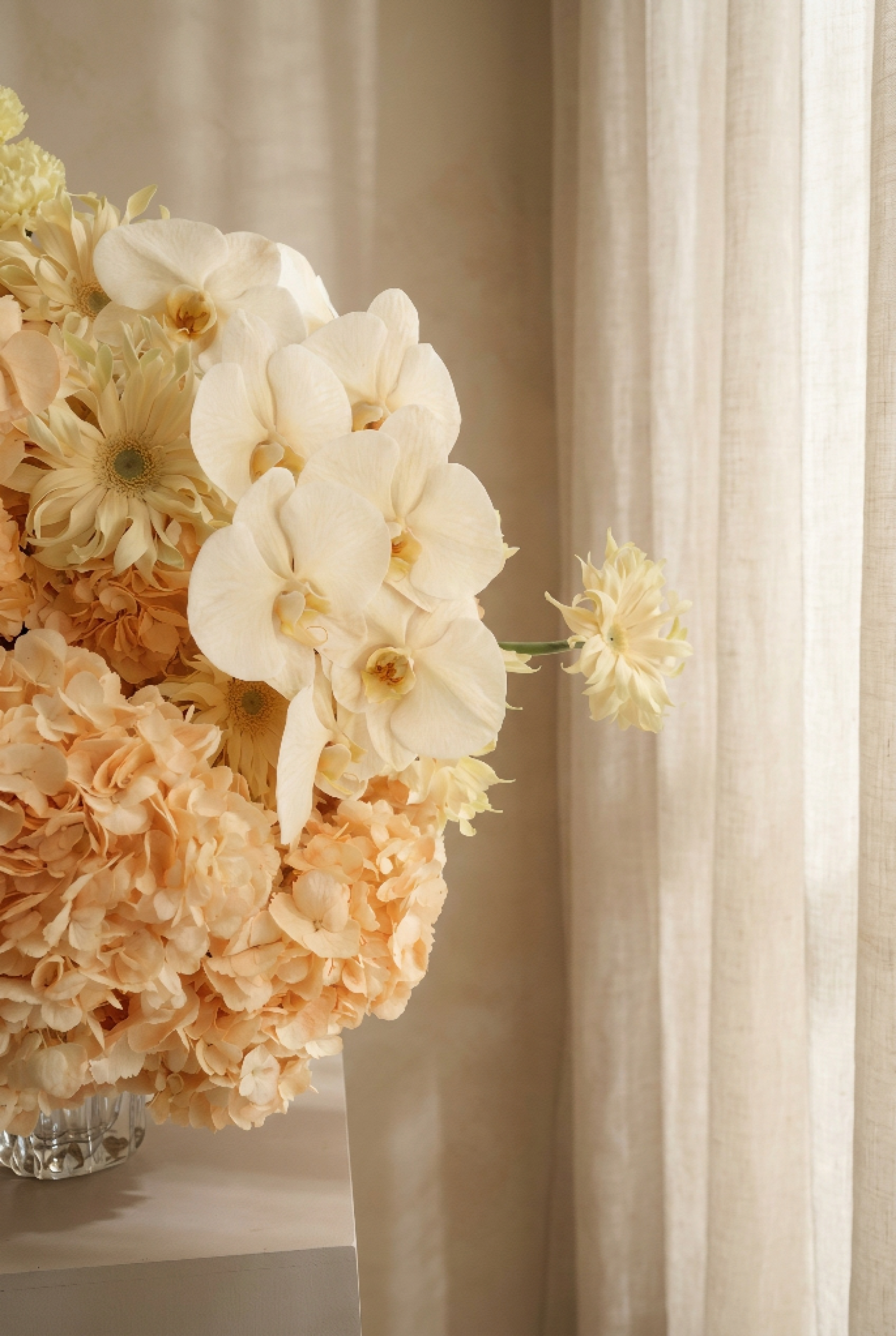 Peach Floral Arrangement in a Crystal Vase
