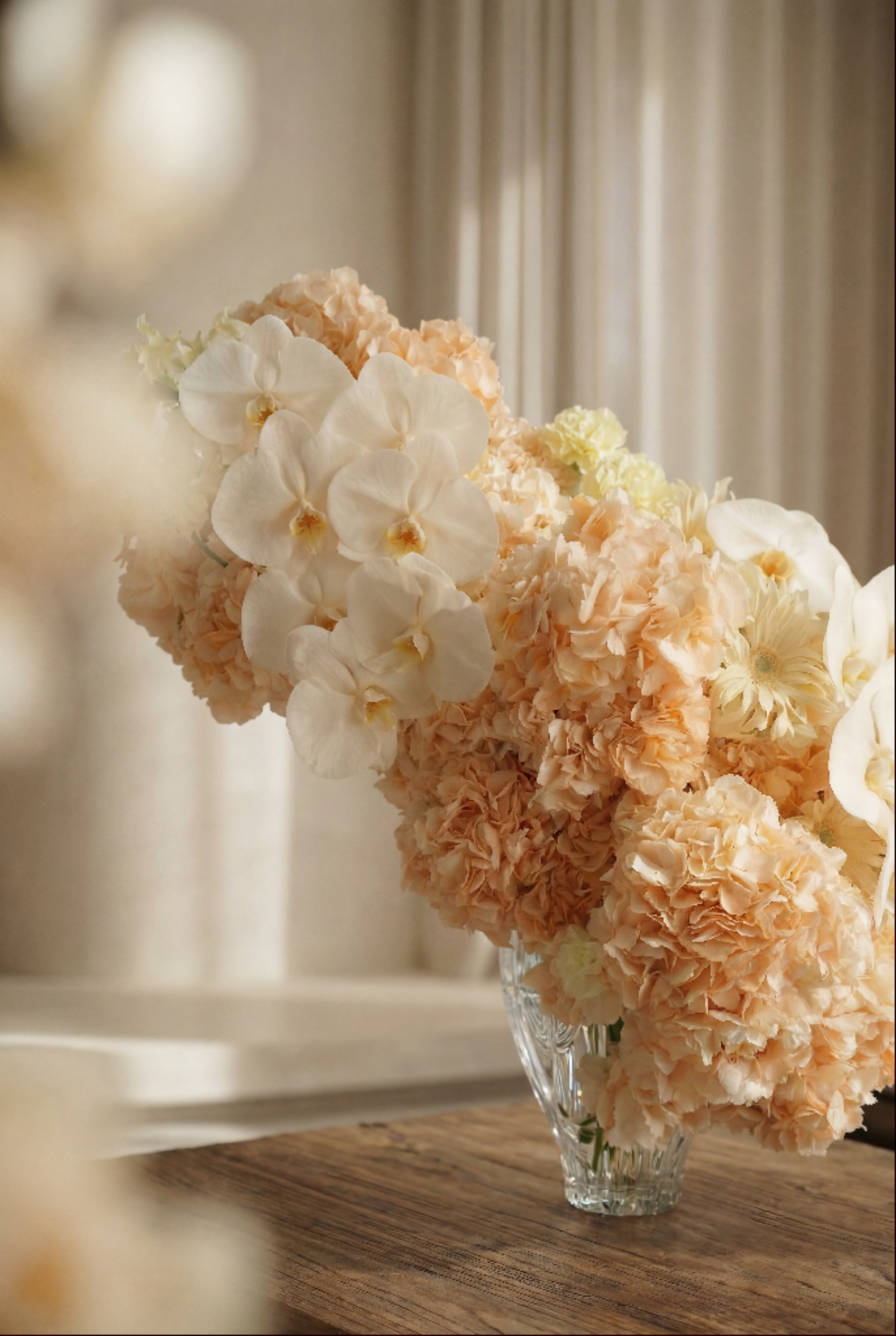Peach Floral Arrangement in a Crystal Vase