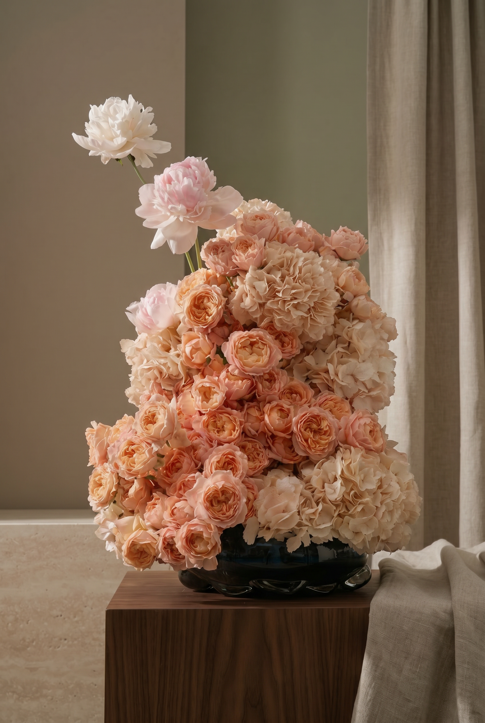 Peach and Blush Floral Arrangement in a Black Glass Vase