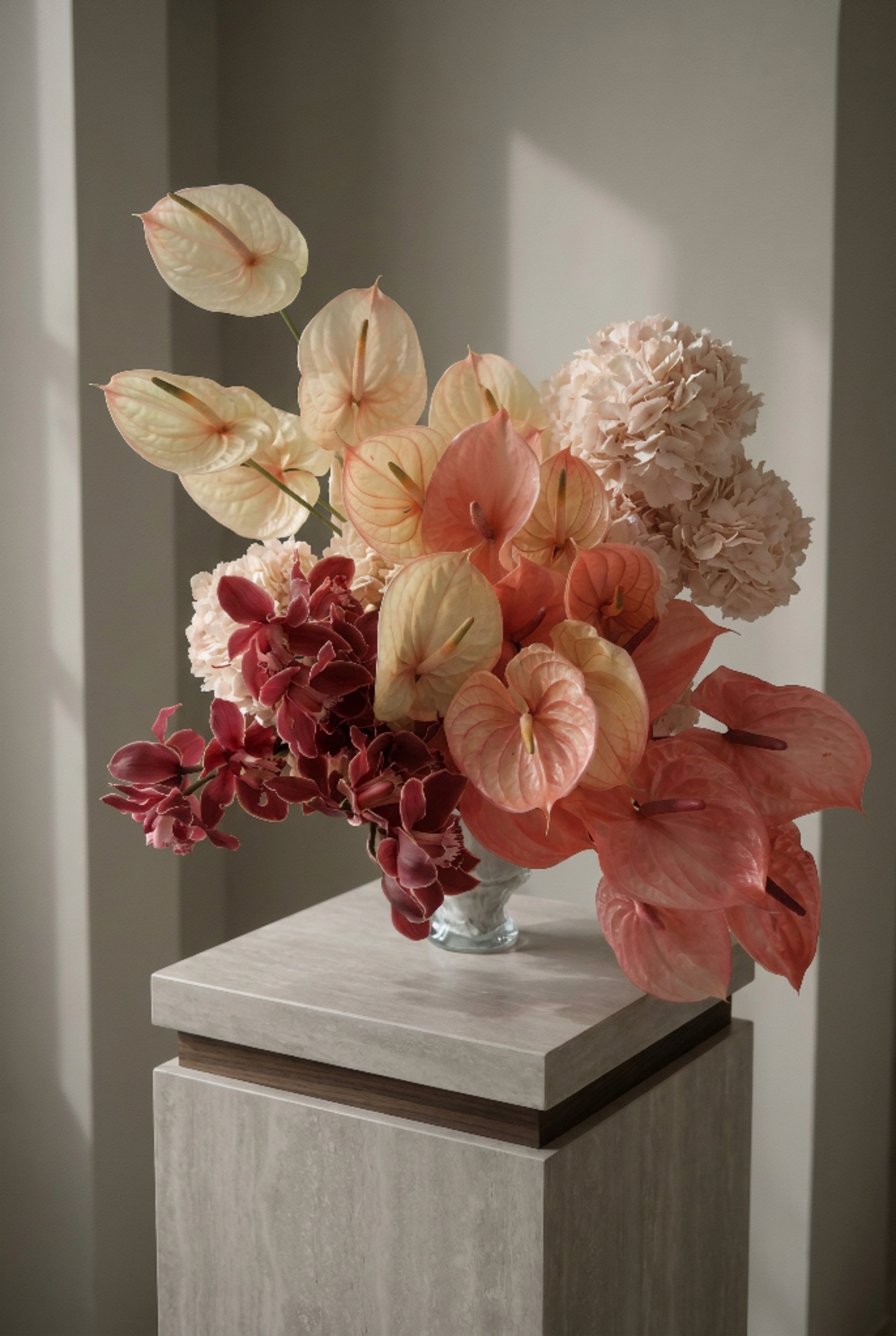 Red and Peach Floral Arrangement in a Crystal Vase