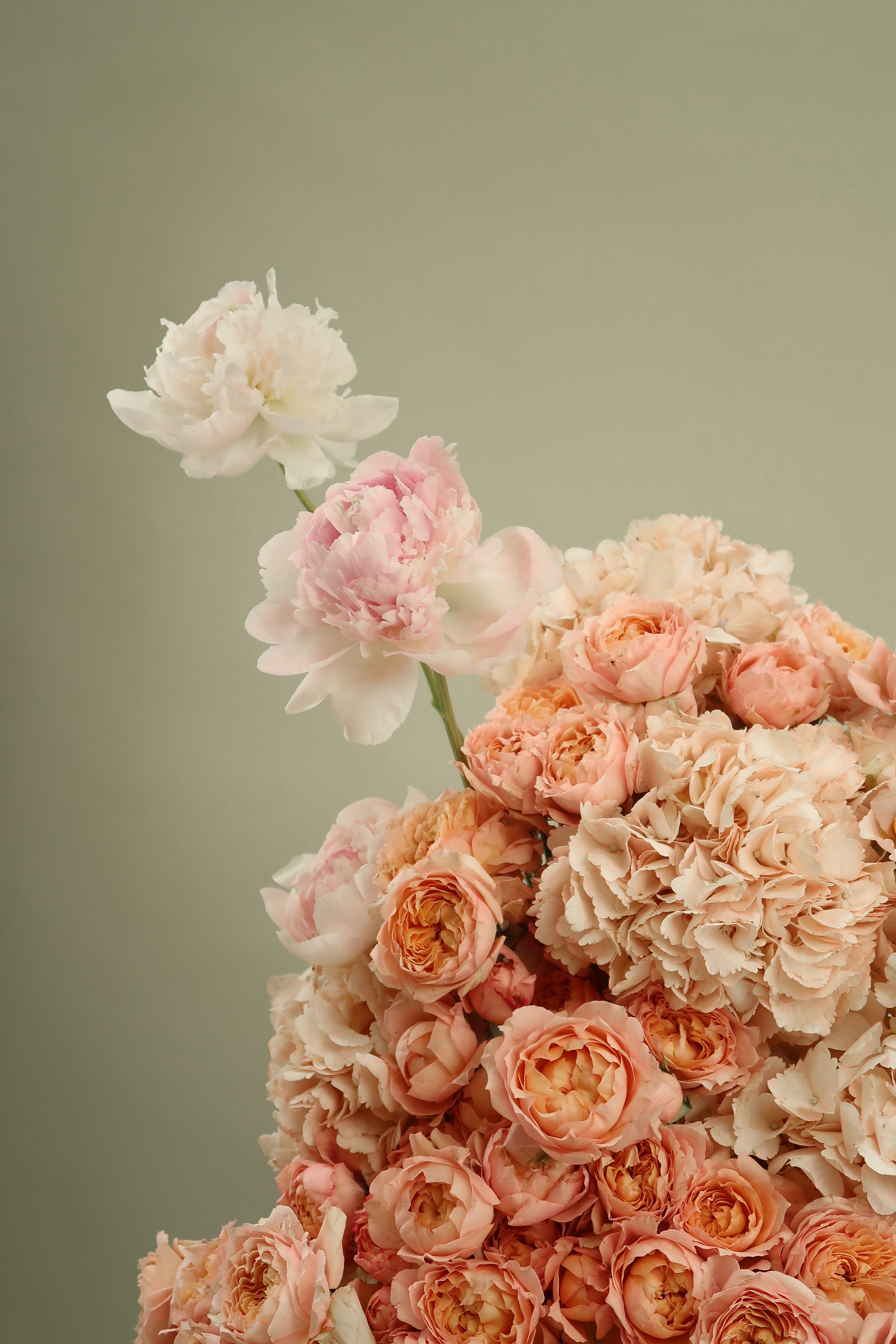 Peach and Blush Floral Arrangement in a Black Glass Vase