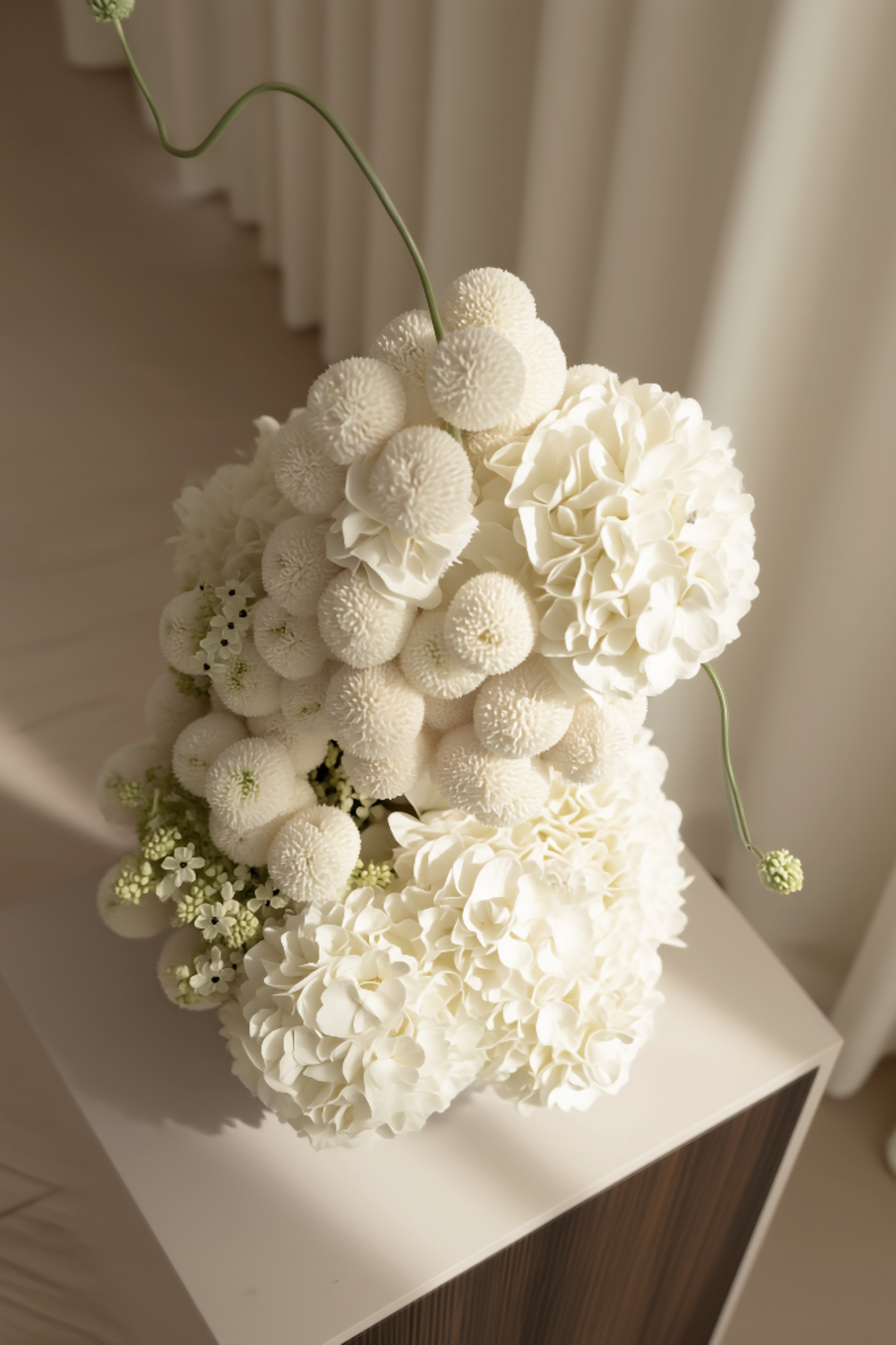 Pure White Floral Arrangements in Mother of Pearl Inspired Vase
