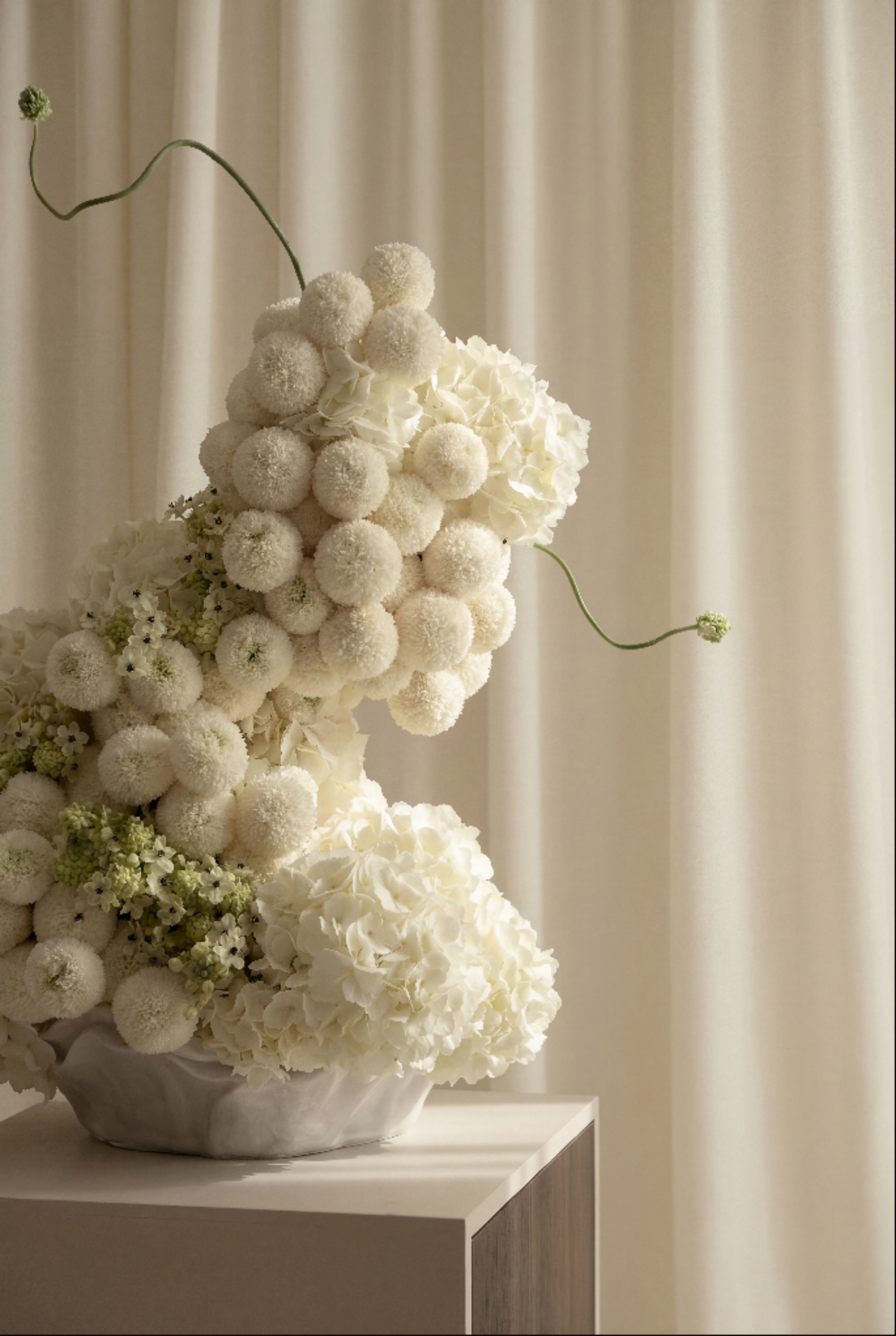 Pure White Floral Arrangements in Mother of Pearl Inspired Vase