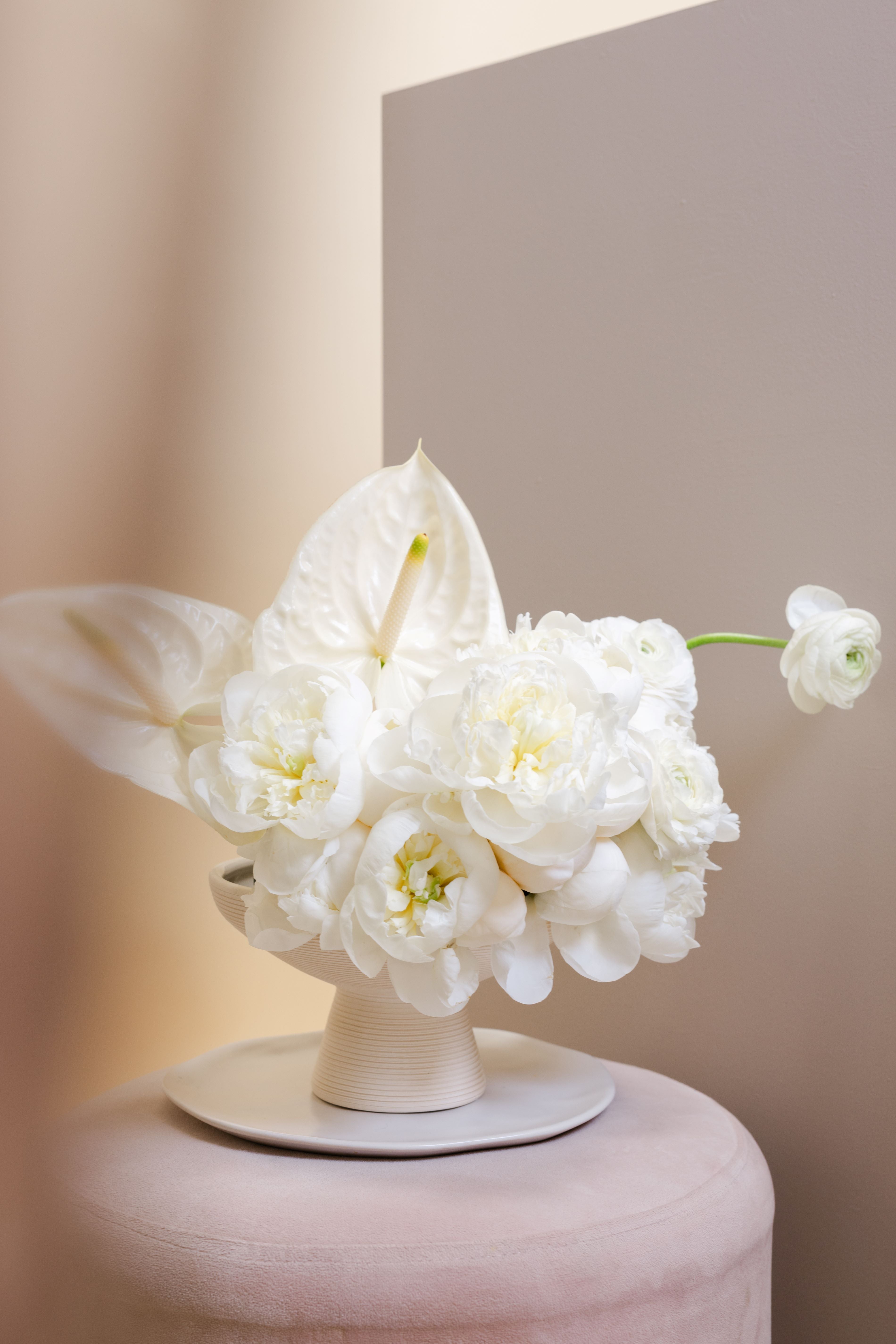 Gifting with a White Floral Arrangement in a Vase